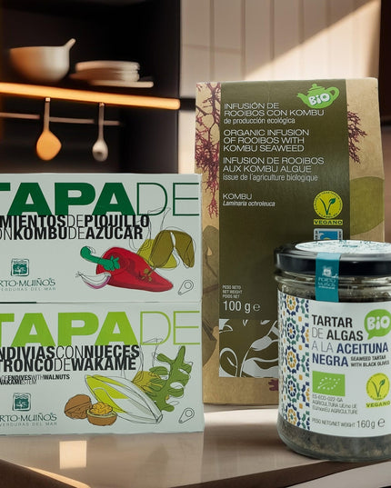 Bodegón con tapas de endivias y pimientos, además de tartar y té con rooibos sobre una cocina